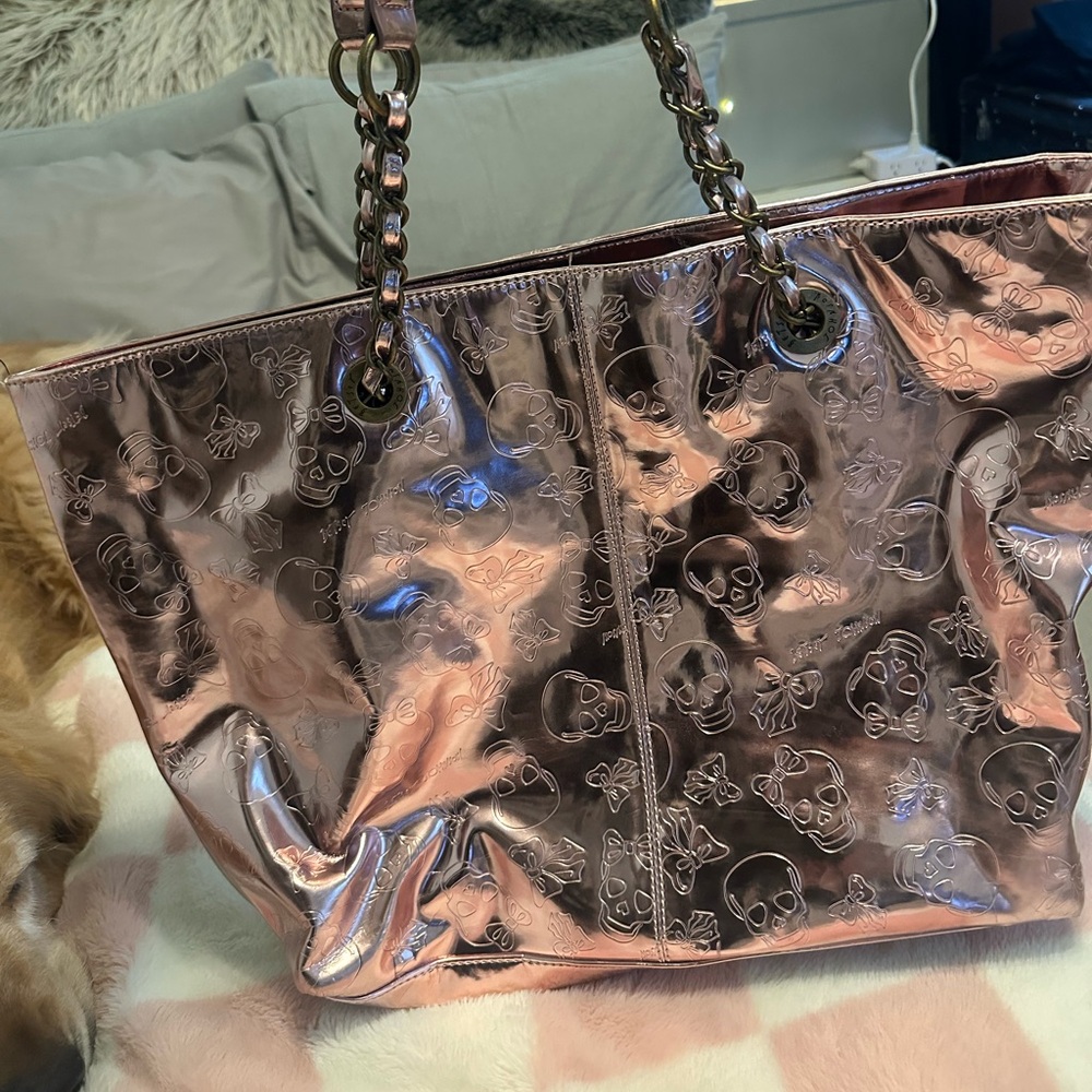 BETSEY JOHNSON ROSE GOLD SKULL EMBOSSED TOTE.